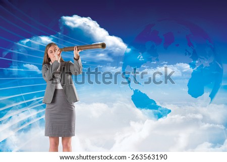 Businesswoman looking through a telescope against global business graphic in blue
