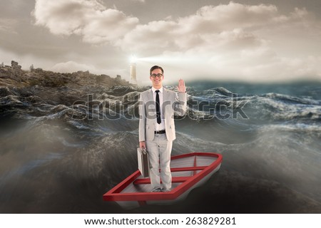 Businessman waving in boat against stormy sea with lighthouse