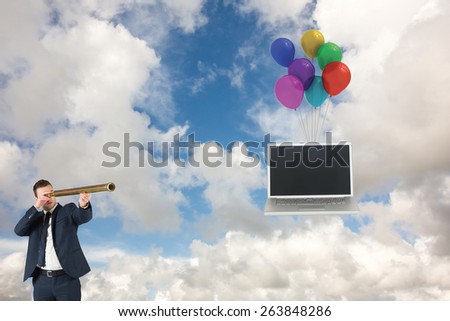 Businessman looking through telescope against blue sky with white clouds
