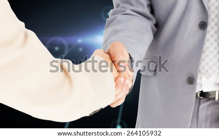 People in suit shaking hands against glowing background with lines