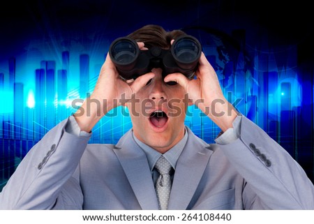 Suprised businessman looking through binoculars against blue bar chart graphic with light