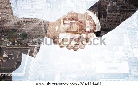 Handshake between two business people against new york