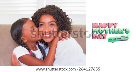mothers day greeting against pretty mother sitting on the couch with her daughter kissing her cheek