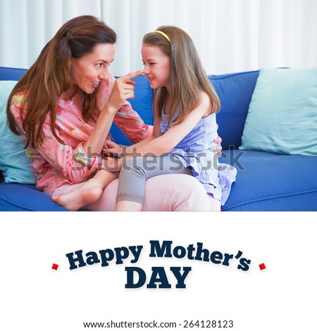 mothers day greeting against mother and daughter on the couch