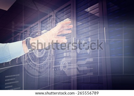 Businessman showing with his hand against digitally generated server room with towers