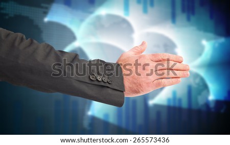 Businessman reaching hand out against global business graphic in blue