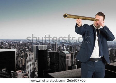Businessman looking through telescope against high angle view of city skyline