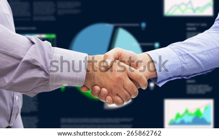 Men shaking hands against business interface with graphs and data