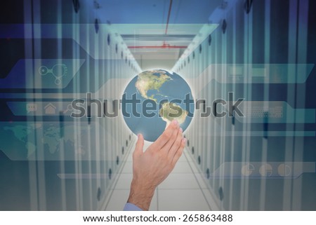 Businessman holding hand out in presentation against abstract technology background
