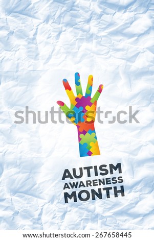 Autism awareness month against crumpled white page