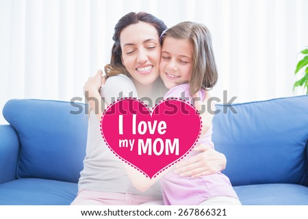 mothers day greeting against mother and daughter hugging on couch