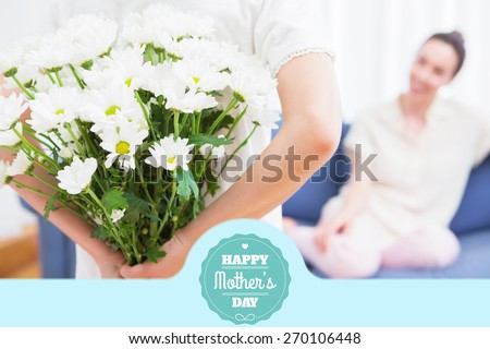 mothers day greeting against daughter giving mother white bouquet