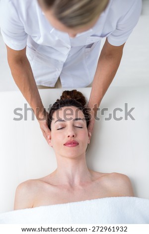 Physiotherapist doing neck massage in medical office