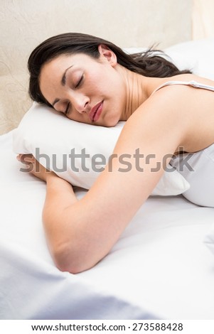 Pretty brunette sleeping on couch at home