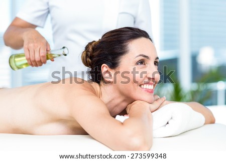 Smiling woman getting an aromatherapy treatment in a healthy spa