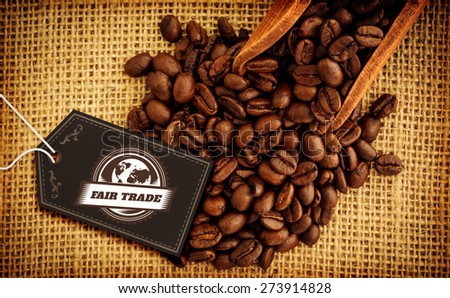 Fair Trade graphic against wooden shovel with coffee beans
