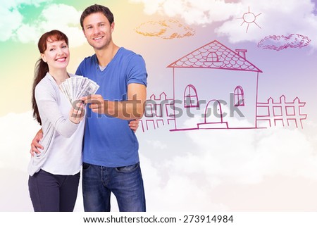 Couple holding fan of cash against blue sky
