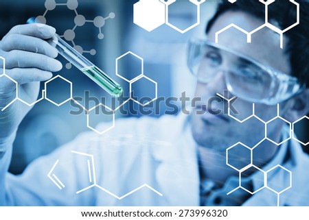 Science graphic against scientist analyzing green solution in test tube at laboratory