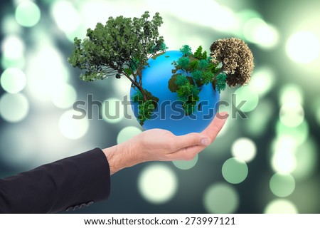 Close up of businessman with empty hand open against light circles on green background