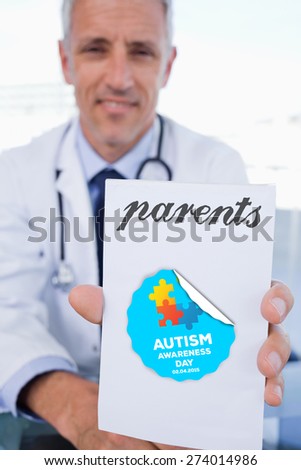 The word parents and portrait of a male doctor showing a blank prescription sheet against autism awareness day