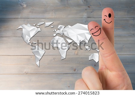 Fingers smiling against bleached wooden planks background