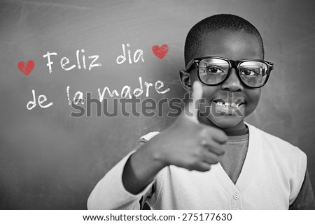 Schoolchild with blackboard against spanish mothers day message