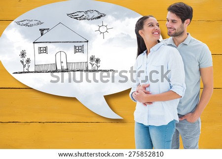 Cute couple embracing and smiling at each other against grey cloudy sky