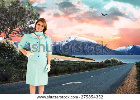 Air hostess against scenic backdrop