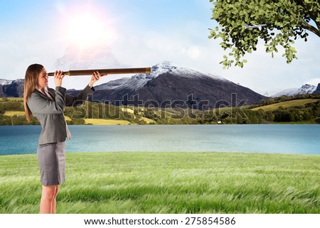 Businesswoman looking through a telescope against scenic backdrop