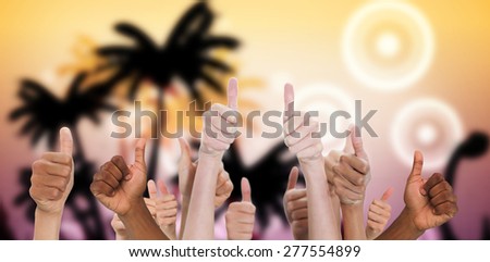 Hands showing thumbs up against digitally generated palm tree background