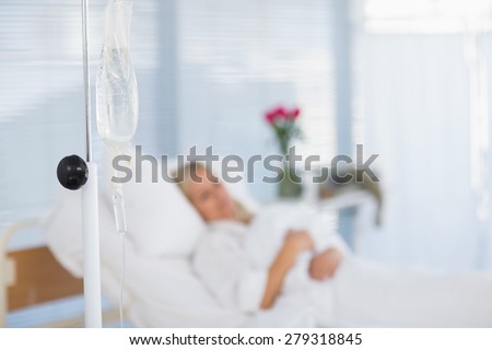 Fuzzy view of patient lying on her bed in hospital