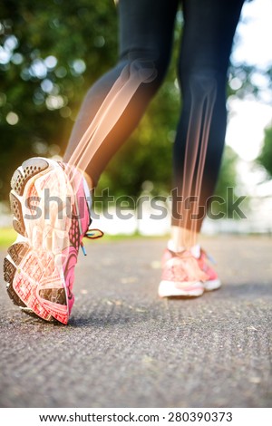 Digital composite of Highlighted foot bones of jogging woman