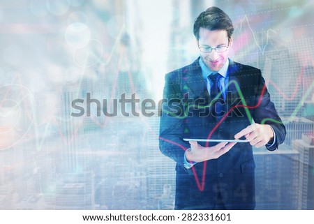 Businessman standing while using a tablet pc against new york