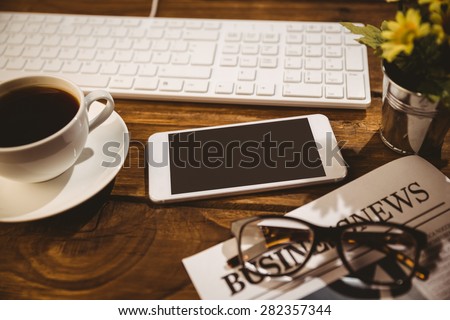 Overhead shot of smartphone on a business desk