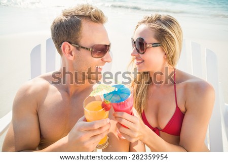 happy couple smiling at the beach