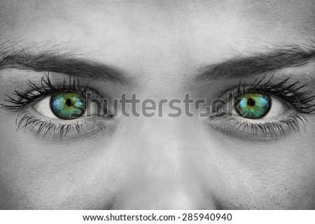 Blue eyes on grey face against spiral