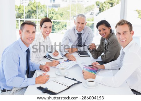 Business team analyzing the graphs in the office