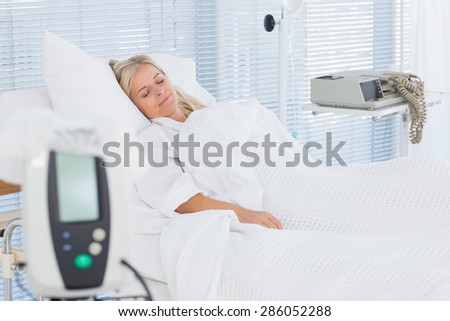 Happy patient lying on her bed in hospital