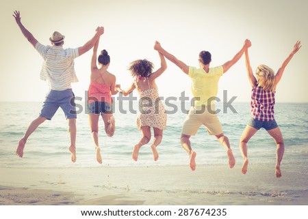 group of friends having fun at the beach