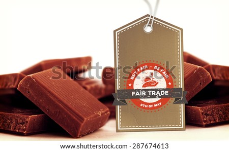 Fair Trade graphic against chocolate pieces piled together