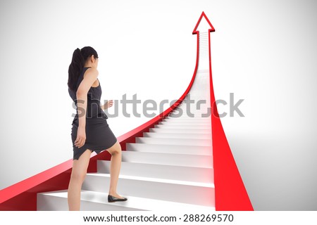 Businesswoman stepping up against white background with vignette