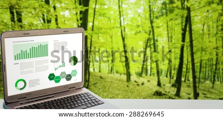 Business interface with graphs and data against trees in the autumnal forest