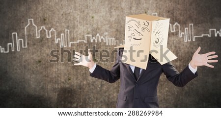Anonymous businessman with hands out against hand drawn city plan