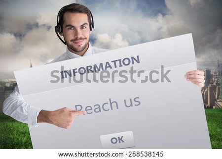 Businessman with headphone showing sign to camera against info box