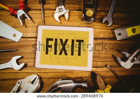 The word fix it and tablet pc against blueprint