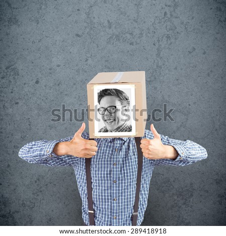 Businessman with photo box on head against dirty old wall background