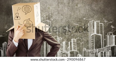 Anonymous businessman touching his chin against hand drawn city plan