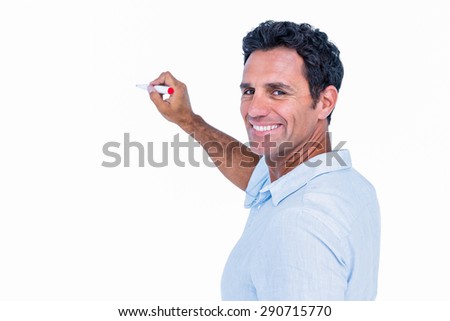 Handsome man writing something with red markers on white background