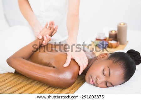 Pretty woman enjoying a delicate massage at the health spa