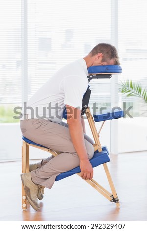 Man in a massage chair in medical office